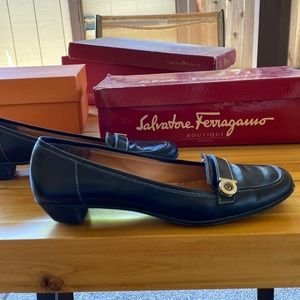 Salvatore Ferragamo black leather walking shoes.